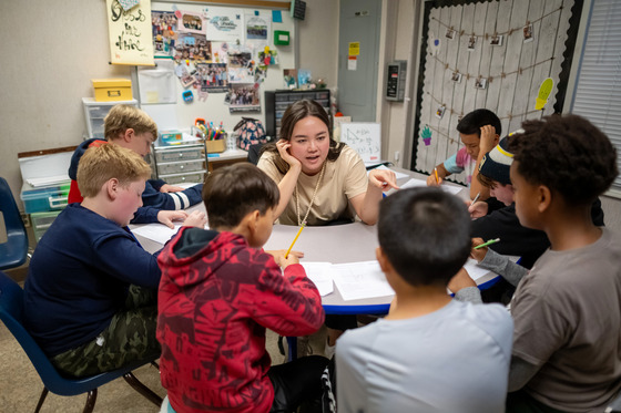 teacher working with students 