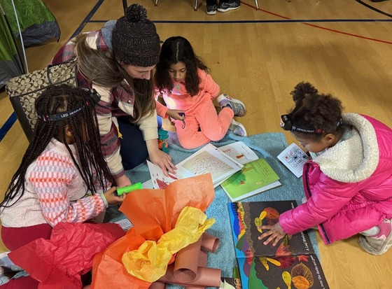 students reading together on the floor