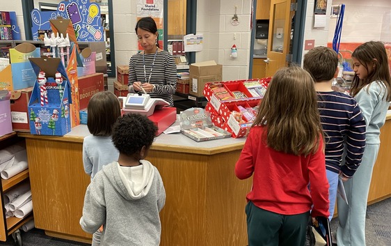 Students purchasing books at the Book Fair