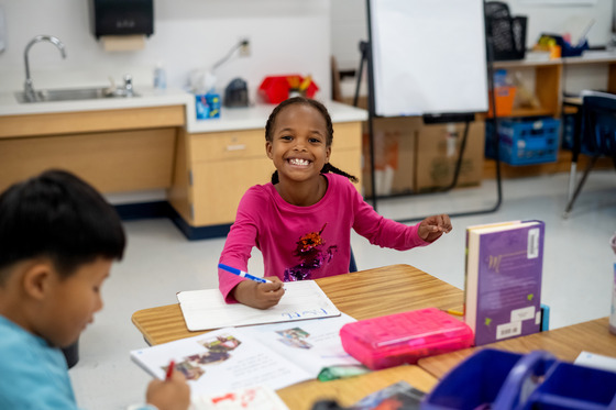 student smiling in class