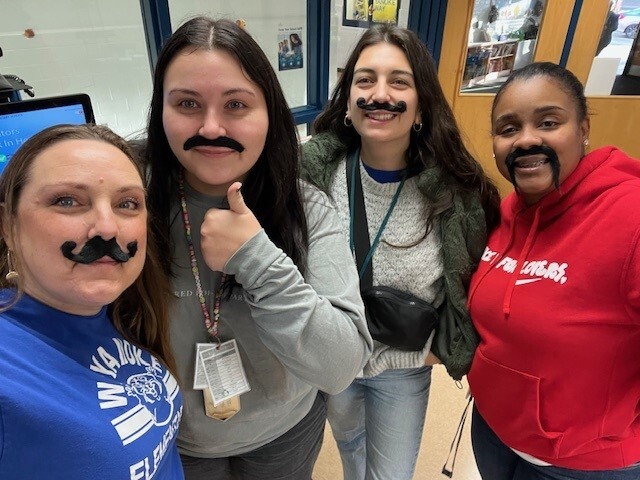 Staff participating in Moustache Day