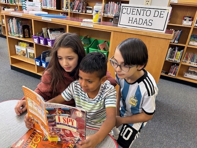 students reading book