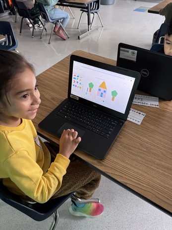 Students explore a new math computer app during a technology lesson