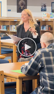 Principal Georgina Aye teaching parents seated at desks