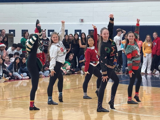 Woodson Precisionettes high kicking at the pep rally