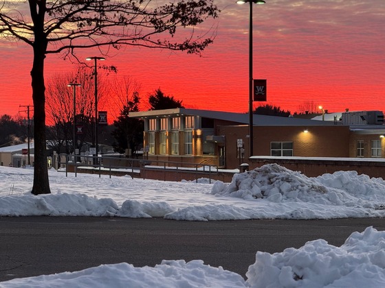 Sunrise over the snowy grounds of Woodson Monday morning