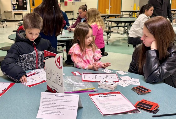 student playing math game at math night