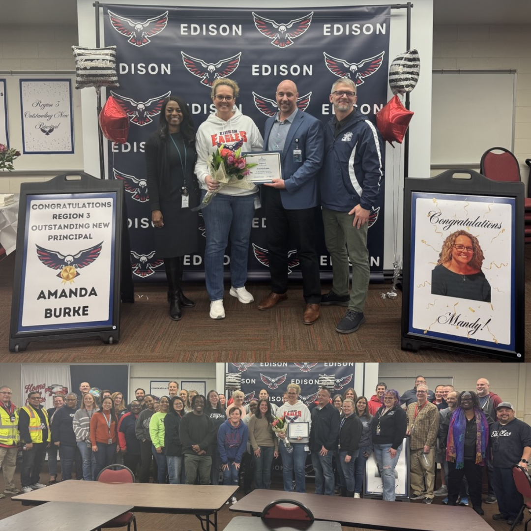 adults standing in front of a sign that says edison