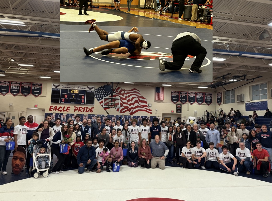 students wrestling and others standing with their parents