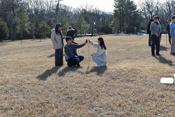 Geosystems students measuring for short wave radiation
