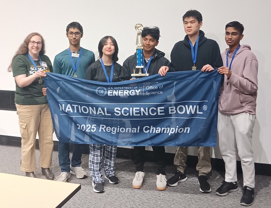 TJ Science Bowl Team holding the Virginia Regional Science Bowl Tournament banner