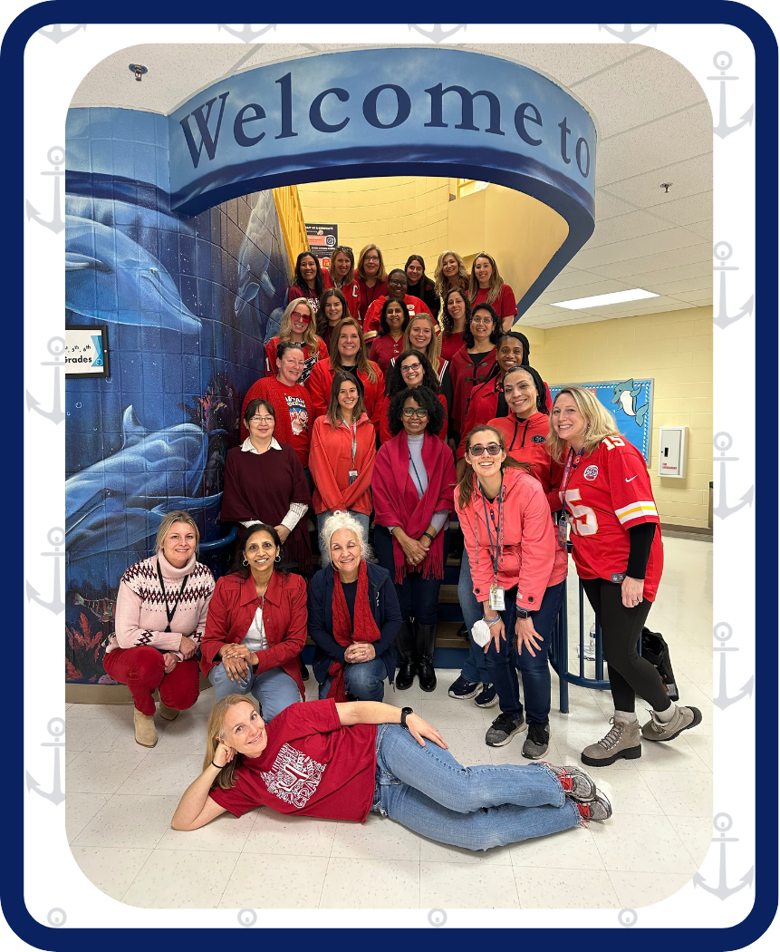Image of Navy Staff on main stairs wearing red