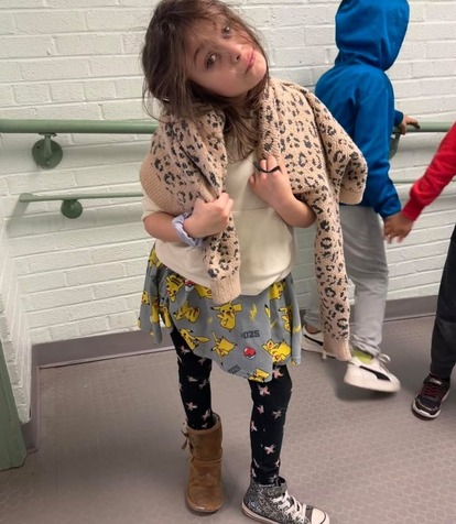 Student poses in mixed up clothing 