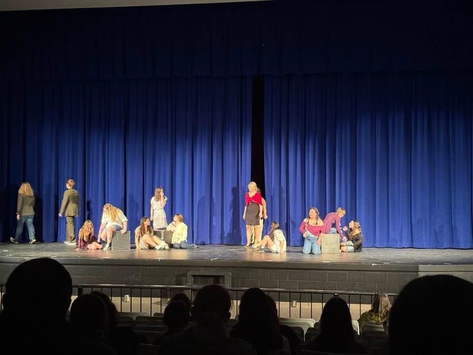 students preforming on stage