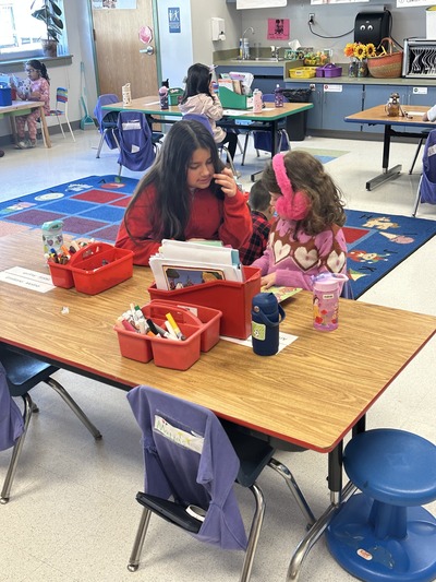 A student reads to another student