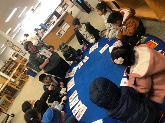 Students sit in the circle in the library