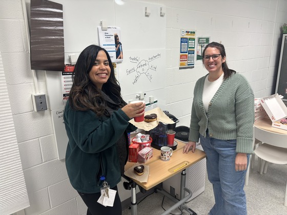 Teachers pose with treats provided by the PTA 