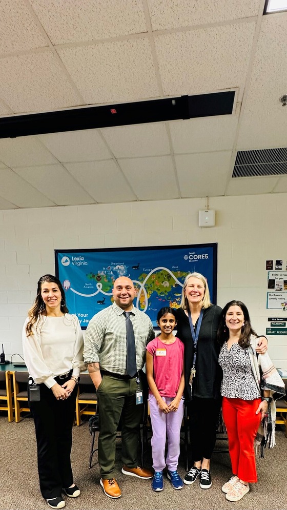 Spelling Bee Champion and staff members