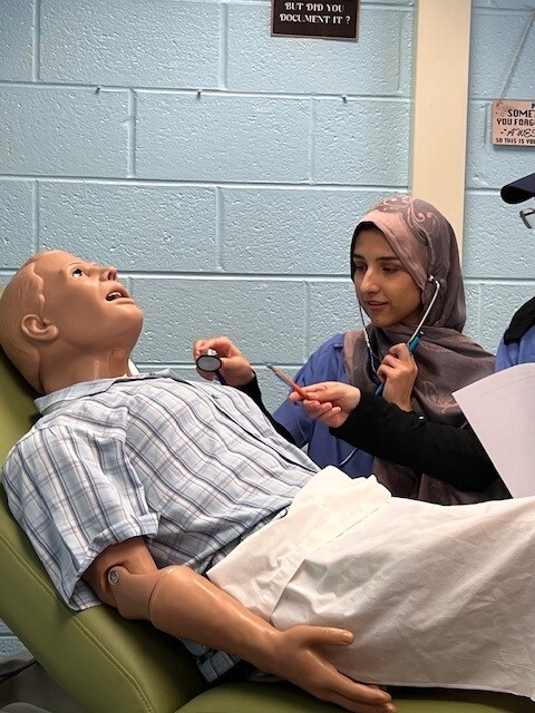 Student practicing vital signs