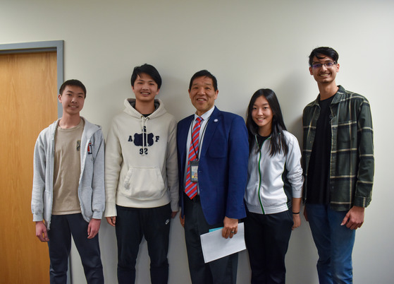 Physics students thanking Mr. Mukai for finding a way for them to take F=MA Test on snow day