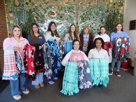 McLean students holding blankets to donate