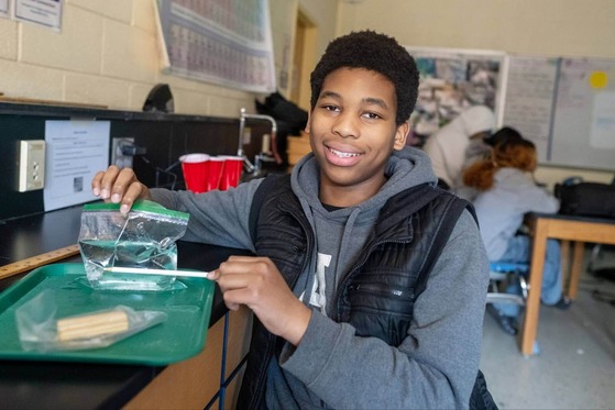 student in science class