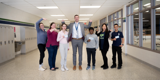 teachers smile in the hallway