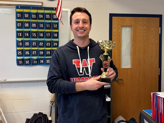 Teacher Mr. Spero takes come Faculty Chili Cookoff trophy