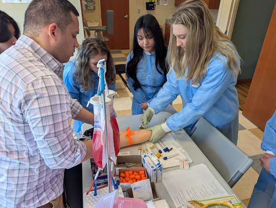 Students learning to do blood draws