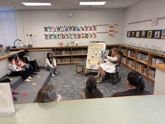 5th Graders gathered around for a read aloud at math/literacy night