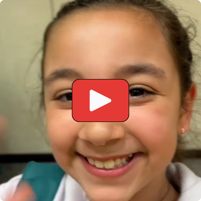 smiling student with play button on top