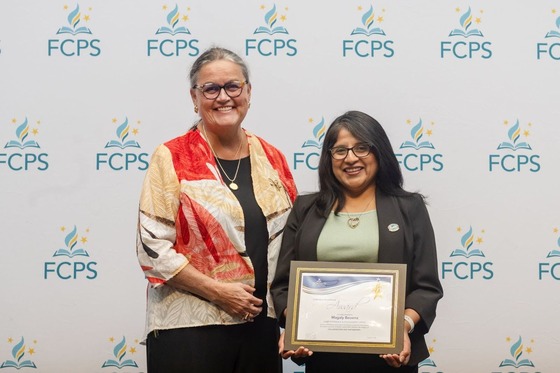Dr. Reid smiles with award winner