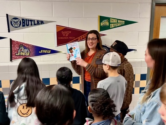 Melanie with Kids at Reading Day