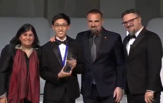 Ray Zhang with his trophy after winning 10th place at Regeneron Science Talent Search