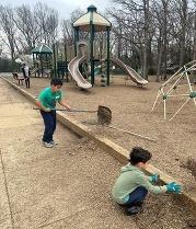 Students helping to clean up the schoolyard.