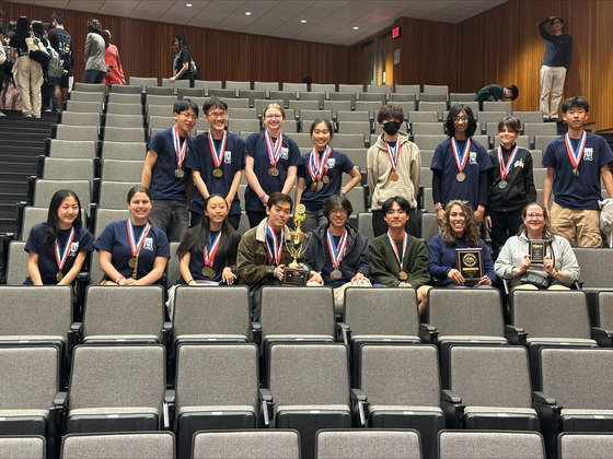The TJ Science Olympiad Team with their trophies