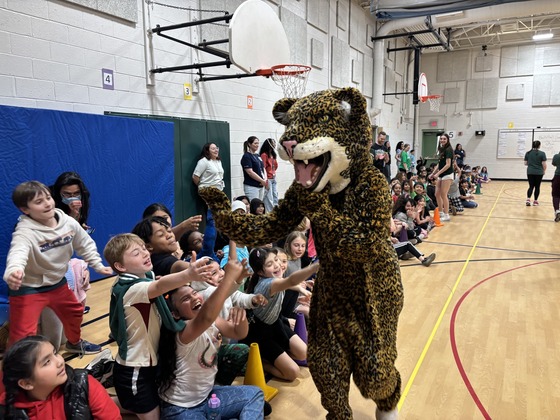 The FCHS Jaguar gives students a high five! 