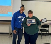 teacher with an award