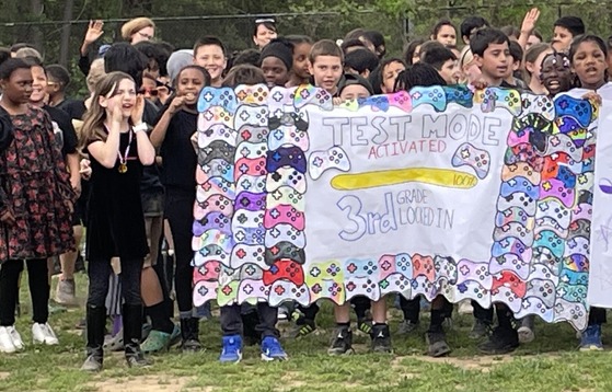 3rd graders cheering at the testing pep rally, where they won the spirit stick