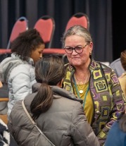 Dr. Reid listens to a staff member