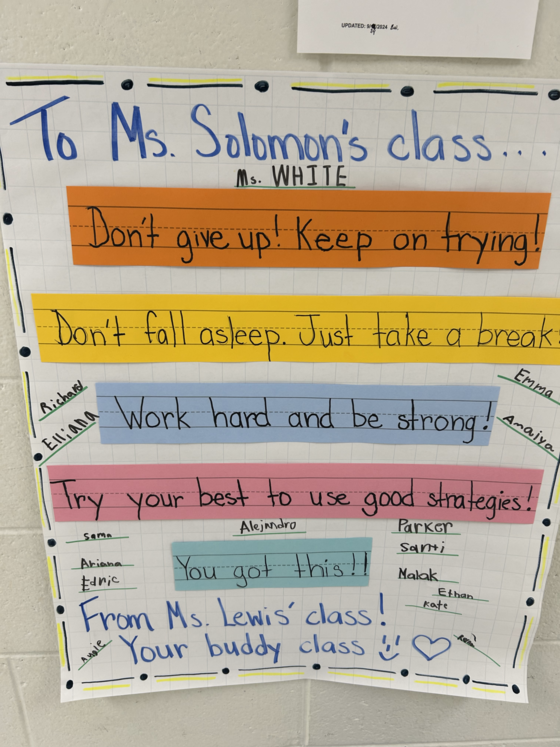 First graders encourage their buddy class to do their best on the SOLs.