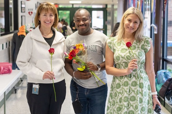 teachers smile for a photo