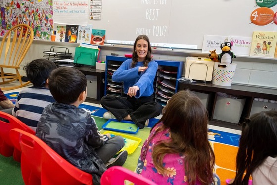 teacher working with students