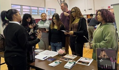 Students and Adults standing at table