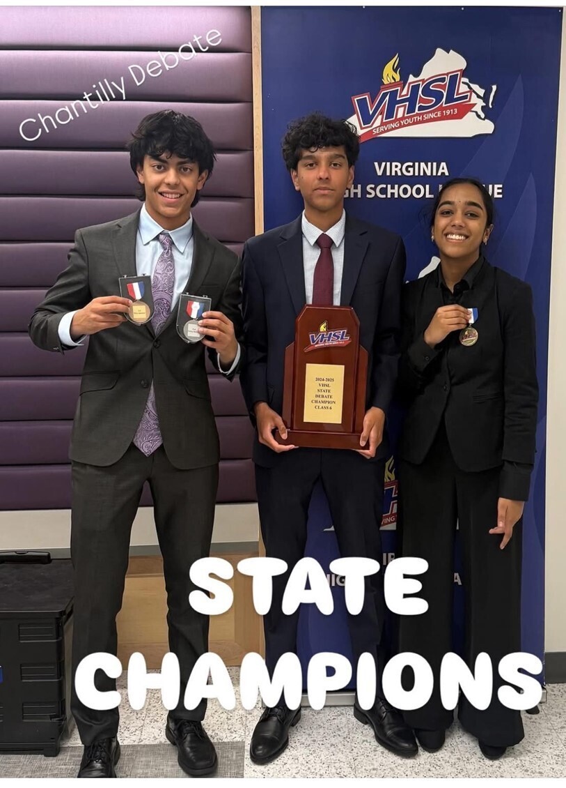Students holding trophy and medals