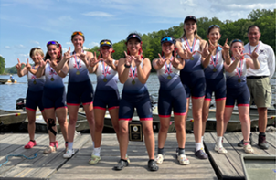 Rowing team students standing