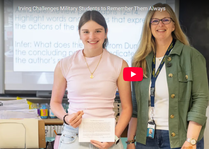 Student holding challenge coin