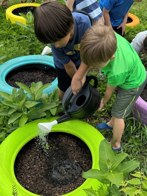 student working in the learning garden