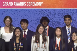 Group of young adults in formal attire at a Grand Awards Ceremony.