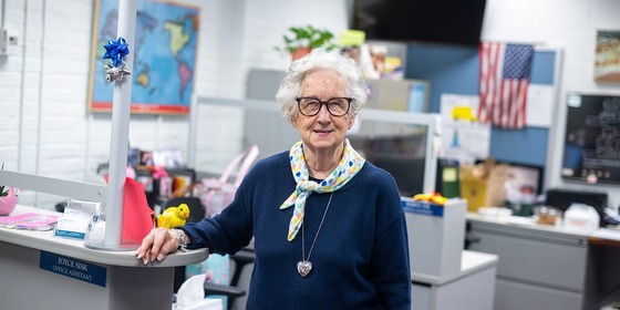 Office Assistant smiling in her office